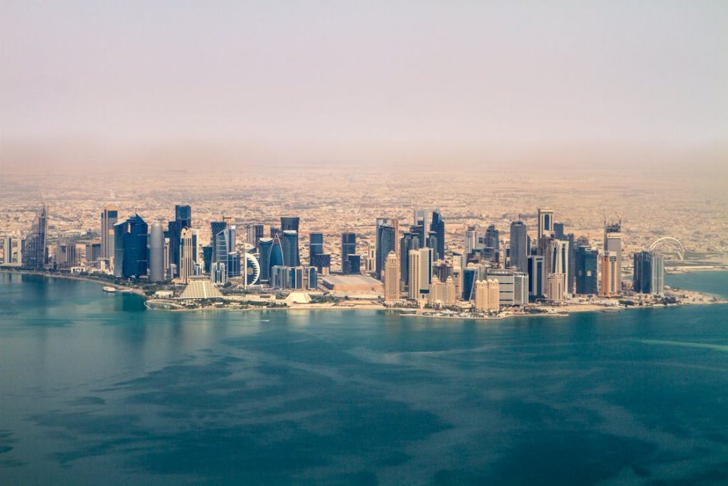 Aerial view of Doha financial district skyline representing Qatar banking sector